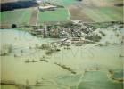  - Photo réf. AER1963_16 - Inondation des champs et d'une partie du village.