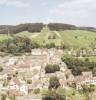 Photos aériennes de "siècle," - Photo réf. 702556 - L'glise du XII sicle et l'oratoire de la Vierge Notre-Dame-de-Bonne-Esprance sur la colline  l'arrire-plan.