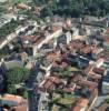 Photos aériennes de "photo." - Photo réf. 54641 - Deux vieilles glises romanes du XIIe sicle se situent dans la ville, on peut en apercevoir une  gauche de la photo.