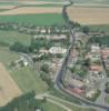 Photos aériennes de "Village" - Photo réf. 57341 - Tranversant la village, la route semble partir  l'horizon.