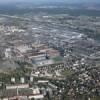 Photos aériennes de "Plan" - Photo réf. N017988 - Une importante usine Peugeot est implante aux portes de la ville. Au premier plan, le stade Bonal du FC Sochaux