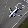 Photos aériennes de "aeroport" - Photo réf. N028374 - Un Airbus A319 au dcollage piste 23  Strasbourg Entzheim (Bas-Rhin).
