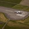 Photos aériennes de "aeroport" - Photo réf. N029402 - Un Embraer ERJ-145 au dcollage piste 13  l'aroport de Pau-Pyrnes.