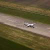Photos aériennes de "aeroport" - Photo réf. N029403 - Un Embraer ERJ-145 au dcollage piste 13  l'aroport de Pau-Pyrnes.