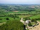 Photos aériennes de "châteaux" - Photo réf. T051603 - Les ruines d'un ancien chteau-fort surveillent le village perches sur leur colline.
