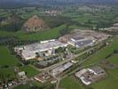 Photos aériennes de "activités" - Photo réf. T052967 - Une usine  Autun (Sane-et-Loire) avec les terrils en arrire-plan.