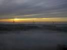 Photos aériennes de "eoliennes" - Photo réf. T082244 - Une nappe de brouillard laisse apparatre des oliennes au coucher du soleil (Meurthe-et-Moselle).