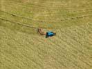 Photos aériennes - Cultures céréales et vigne - Photo réf. T099704 - Un tracteur en andainage.