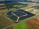 Photos aériennes de "EDF" - Photo réf. U113124 - Le chantier d'installation de la plus puissante centrale photovoltaique du monde sur l'ancienne base arienne 136 de Toul-Rosires par EDF Energies Nouvelles au 29 Aot 2011.