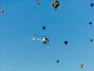 Photos aériennes de "travail" - Photo réf. E145959 - L'hlicoptre de l'Europe vue du ciel en plein travail de prises de vues ariennes autour des montgolfires du Mondial Air Ballons 2013.