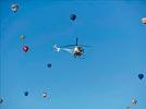 - Photo réf. E145960 - L'hlicoptre de l'Europe vue du ciel en plein travail de prises de vues ariennes autour des montgolfires du Mondial Air Ballons 2013.