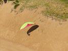  - Photo réf. E147940 - Des parapentes en vol de pente le long des dunes.