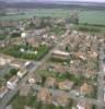  - Photo réf. 174055 - Le coeur du village et son glise paroissiale Sainte-Barbe de 1938, surnomme  La Dame de Fer . C'est la dernire glise d'Europe construite en fer.