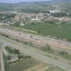 Photos aériennes de "ligne" - Photo réf. 20915 - Le bourg est travers par la ligne TGV et la RN 79.