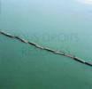 Photos aériennes de "plages" - Photo réf. 41367 - Sur le littoral d'Arromanches-les-Bains ces caissons Phoenix, au nombre de 146, étaient destinés à la formation des jetées-abris devant les ports Mulberries A et B.
