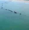 Photos aériennes de "manche" - Photo réf. 41369 - Sur le littoral d'Arromanches-les-Bains ces caissons Phoenix, au nombre de 146, taient destins  la formation des jetes-abris devant les ports Mulberries A et B.