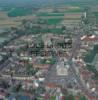 Photos aériennes de "deux" - Photo réf. 47971 - Les deux places de la ville se succdent l'une domine par la tour de l'ancien Beffroi, l'autre par les tours de l'glise.