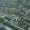 Photos aériennes de "gare" - Photo réf. 48490 - La gare et la voie ferre servent de frontire. Aprs le pont, on peut apercevoir la concentration des maisons, avec derrire, les terres cultivables.