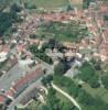 Photos aériennes de "village" - Photo réf. 52140 - Tour de défense à l'origine, l'église du village a traversé les siècles. La première pierre fut posée en 1001.