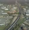 Photos aériennes de "autoroute" - Photo réf. 59848 - De part et d'autre de l'autoroute, la zone industrielle.