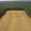 Photos aériennes de "tracteur" - Photo réf. N000759 - A l'orée de la forêt, le ramassage de la paille.