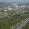 Photos aériennes de "autoroute" - Photo réf. N009457 - Le long de l'autoroute A13, la silhouette du château Robert-le-Diable à l'arrière, la Seine et l'activité industrielle aux abords de Rouen.
