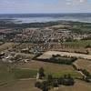 Photos aériennes de La Chevrolière (44118) | Loire-Atlantique, Pays de la Loire, France - Photo réf. N033674 - En arrière-plan, le Lac de Grand-Lieu qui est le plus grand lac de plaine français.