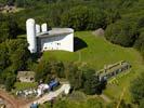 Photos aériennes de Ronchamp (70250) | Haute-Saône, Franche-Comté, France - Photo réf. U112230 - Construite en 1955 par Le Corbusier, la chapelle de Ronchamp ou la chapelle Notre-Dame du Haut attire de nombreux visiteurs avec sa forme atypique.