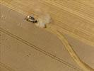 Photos aériennes de "cereales" - Photo réf. E124483 - Une moissonneuse batteuse au travail.