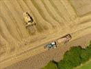 Photos aériennes de "cereales" - Photo réf. E124492 - Une moissonneuse batteuse au travail.