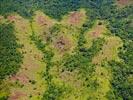 Photos aériennes de "roche" - Photo réf. E125305 - Contraste entre la roche rouge et le vert dense.