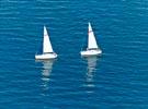 Photos aériennes de "deux" - Photo réf. E131654 - Deux voiliers sortant en mer au large de la Pointe de Kerhermén