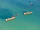 Photos aériennes de "wwii" - Photo réf. E144922 - Sur le littoral d'Arromanches-les-Bains ces caissons Phoenix, au nombre de 146, taient destins  la formation des jetes-abris devant les ports Mulberries A et B.