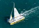 Photos aériennes de "plaisance" - Photo réf. E146477 - Maxi catamaran longeant la côte de Port Leucate