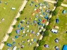Photos aériennes de "camping" - Photo réf. E152708 - La commune de Taizé (Saône-et-Loire) est connue pour sa communauté oecuménique d'une centaine de frères, de très nombreux jeunes y viennent pour prier.